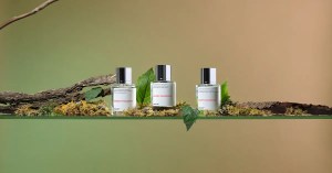 Dossier Woody Hyacinth, Woody Oakmoss, and Fruity Oakmoss perfumes styled with moss, leaves, and natural wood