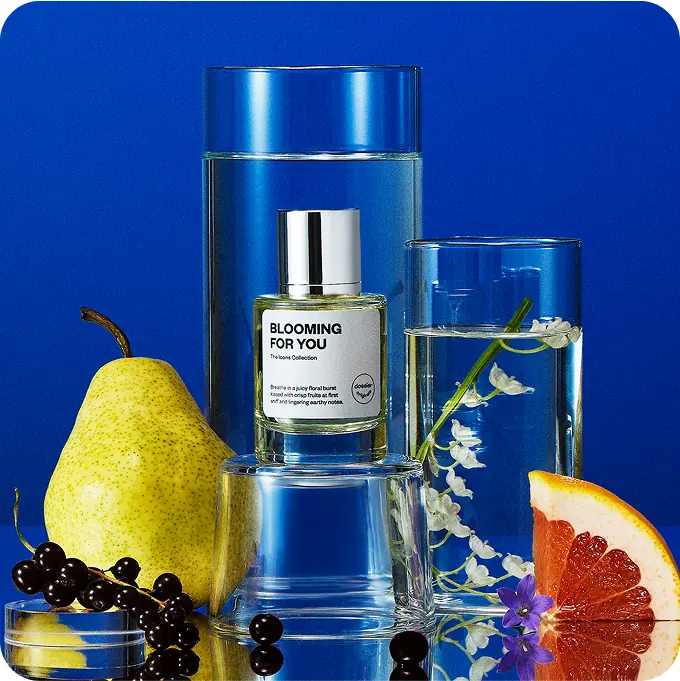Dossier Blooming for You perfume displayed with pear, blackcurrants, grapefruit, and delicate flowers against a vivid blue background.