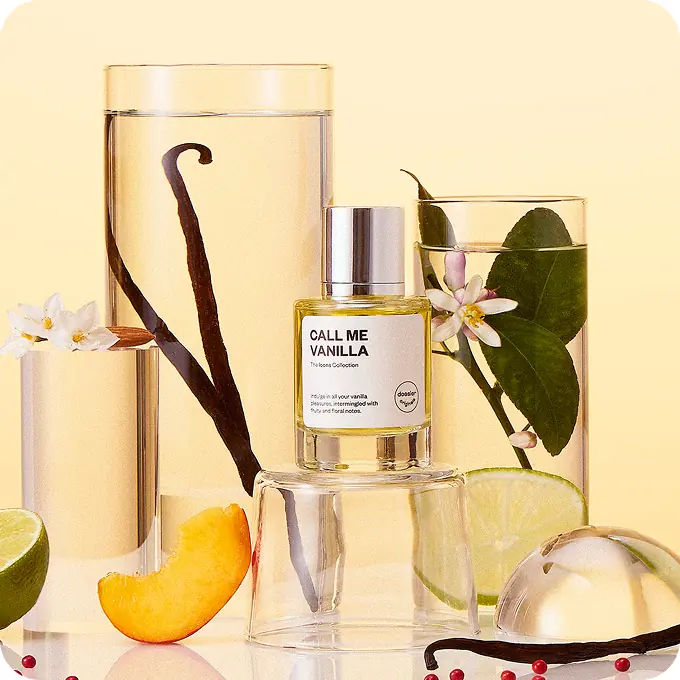Dossier Call Me Vanilla perfume displayed with vanilla pods, citrus blossoms, peach, lime, and pink peppercorns.